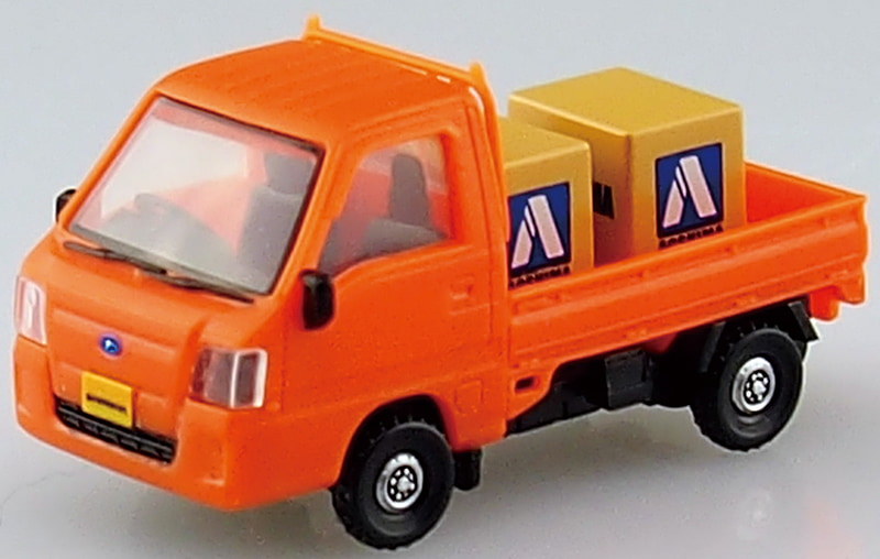 荷台のダンボールにはアオシマロゴを貼付