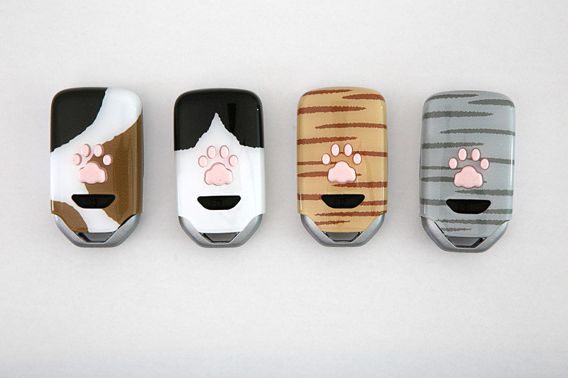 ペットキーカバー（にゃんこ/普通車用/参考出品）。左からみけ、はちわれ、ちゃとらしろ、さばとらしろ