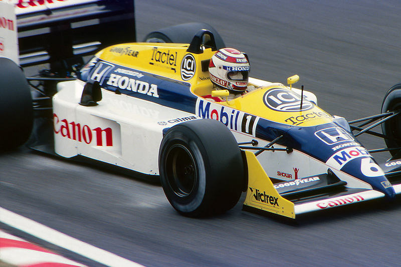 1987年、鈴鹿サーキットのヘアピンに進入するネルソン・ピケ。フロントウィング、サイドポンツーン、リアウィング、ヘルメットにCanonのロゴが見える