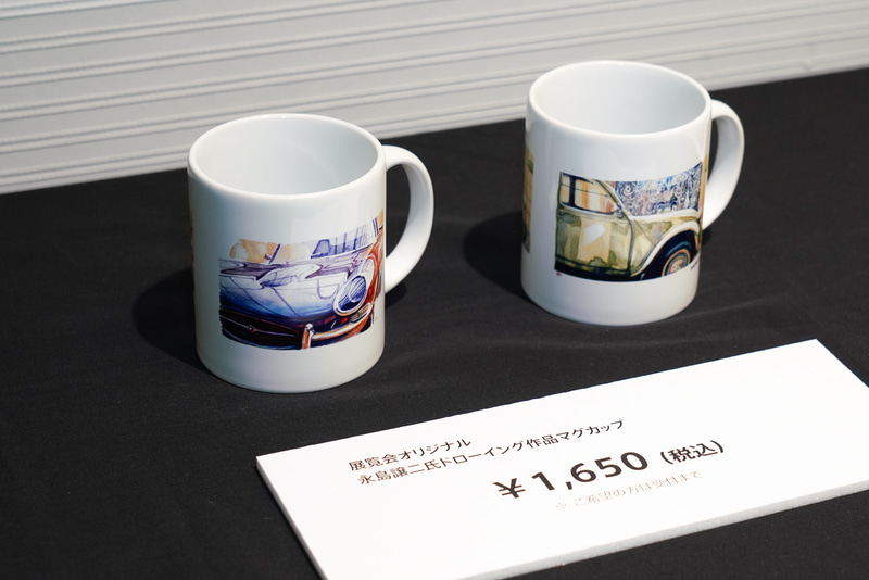 オリジナルグッズの販売。ドローイングが入ったマグカップ