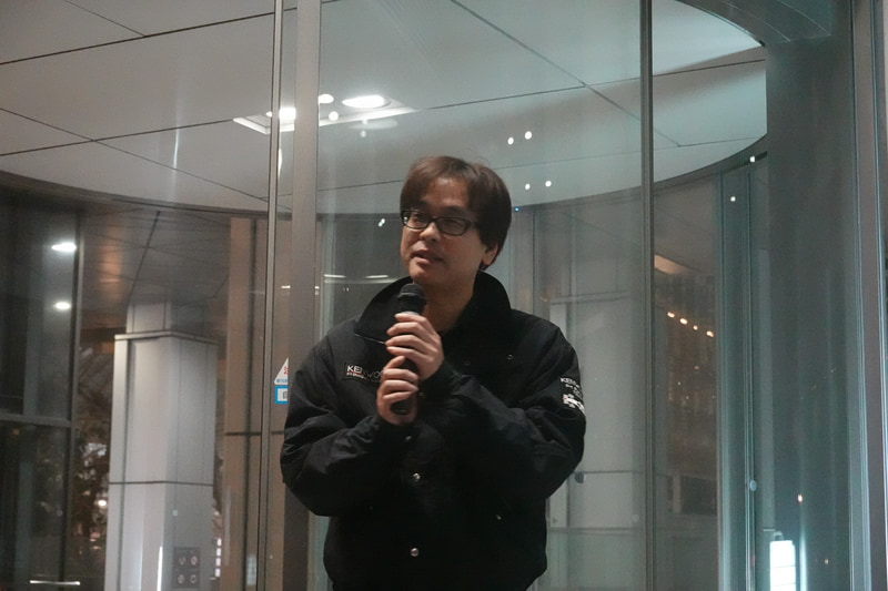 デジタルカメラマガジン 編集長 福島晃。熱田カメラマンはデジタルカメラマガジンでF1の連載を行なっている