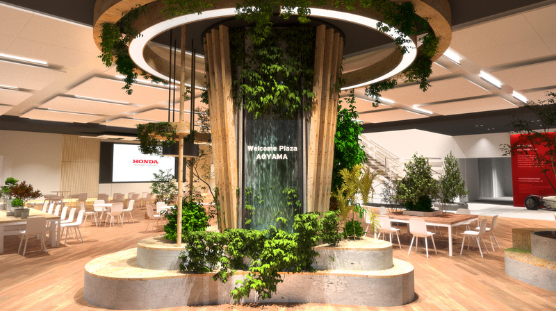 Hondaウエルカムプラザ青山の内装は、「再び訪れたくなる場」をコンセプトにウッドとグリーンを多く取り入れ、親しみやすく居心地のいい空間とした。メインエントランスでは「ワイガヤの木」がお迎えしてくれる
