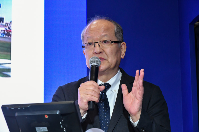 登壇する日本グッドイヤー株式会社 代表取締役社長の金原雄次郎氏