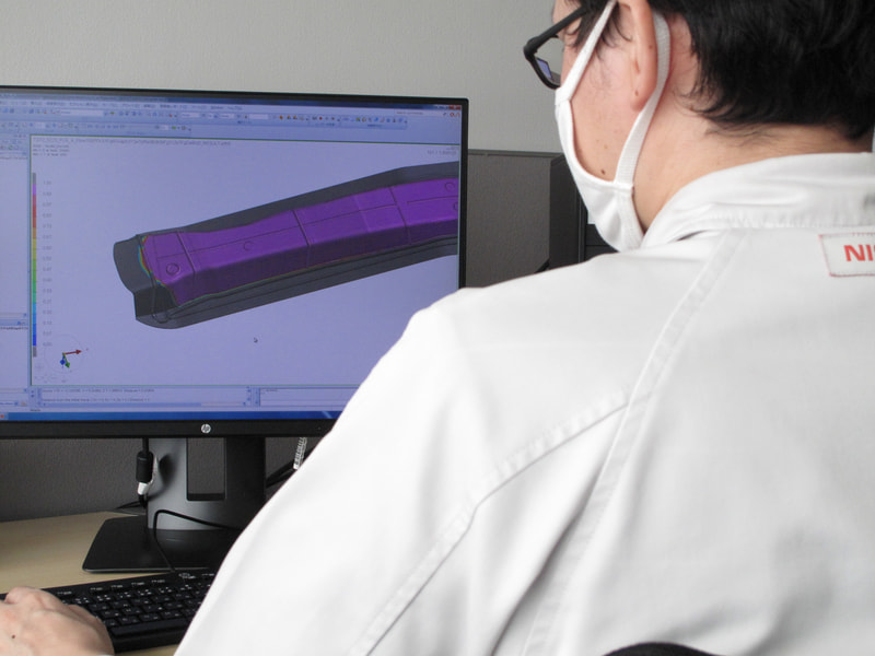 可視化した樹脂の流れから、炭素繊維への樹脂の含浸度合いを高精度にシミュレーションする技術を開発