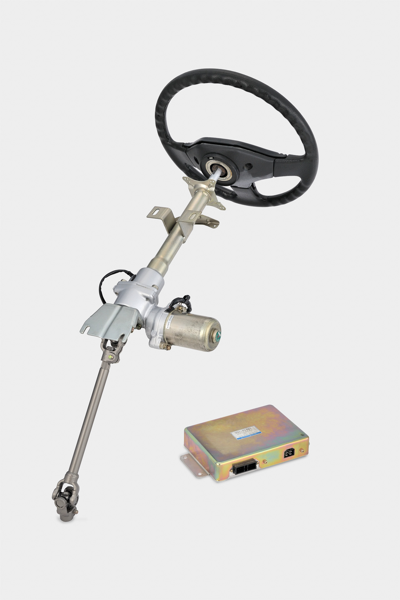 スズキ「セルボ」に搭載された、ジェイテクト・三菱電機共同開発による世界初の「自動車用電動パワーステアリングシステム」