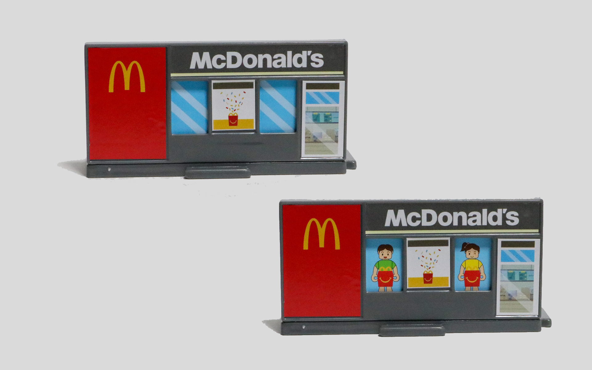 マクドナルドレストランは、裏側に差し込んだカードをスライドさせることで、店内でハッピーセットを食べている子供を見せることもできる