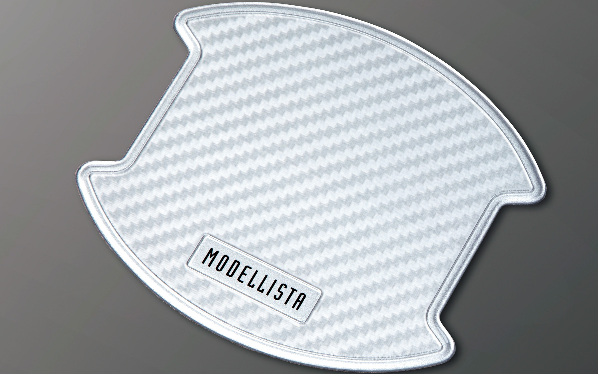 モデリスタロゴの入ったドアハンドルプロテクター（ホワイト）は、1セット2枚入りが3300円、1台分は6600円