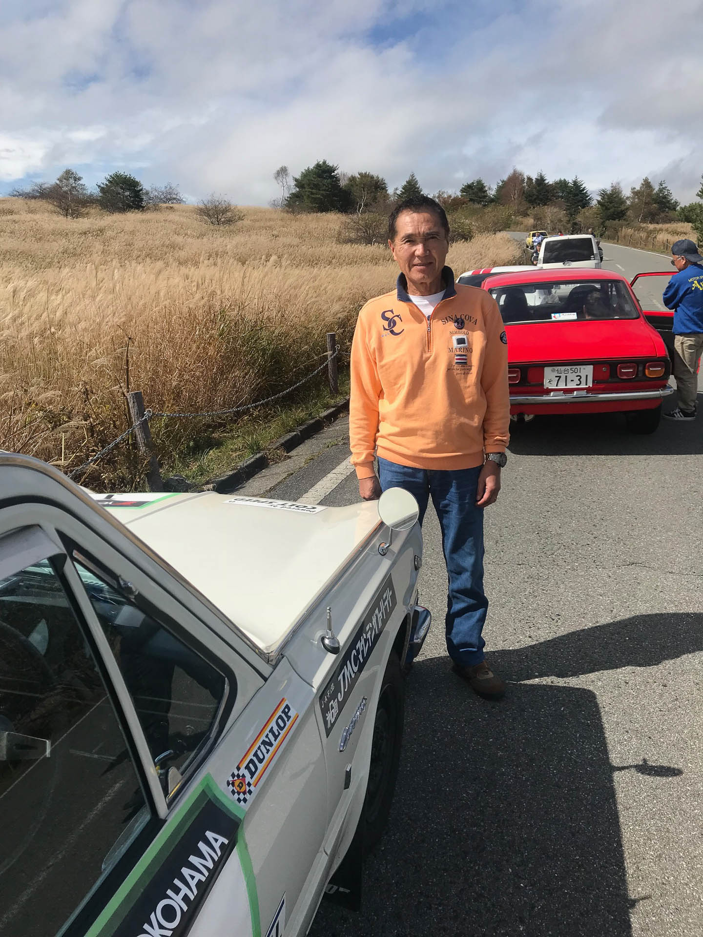 2018年のLegend of THE RALLYでの建次郎さん。バックに映っているレビンは綾部美津雄さん。2人の天才ラリードライバー