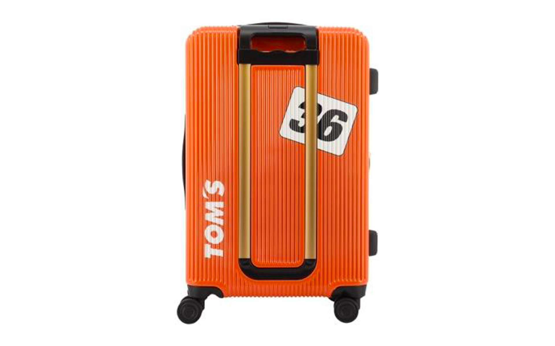 auカラーのオレンジにトムスのロゴとカーナンバー36の入ったスーツケース裏面