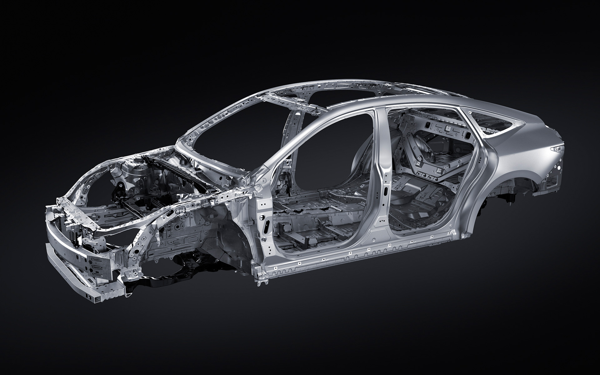 ボディ構造（プロトタイプ）：新型ESでは、専用開発を施し刷新したTNGAプラットフォーム（GA-K）を採用し、HEVとBEVのパワートレーンの設定を可能とした。 また、走りの味に統一感を持たせるためにレクサスがモデル横断で取り組む走りの「味磨き」の知見を取り入れながら、フロントエンド、フロア、リアエンドの剛性を強化。徹底した体幹強化により、ボディの振動を抑制するとともに、クルマの大きさを感じさせない、ドライバーの意図に忠実で素直なステアリング応答性や加速・減速レスポンスを実現