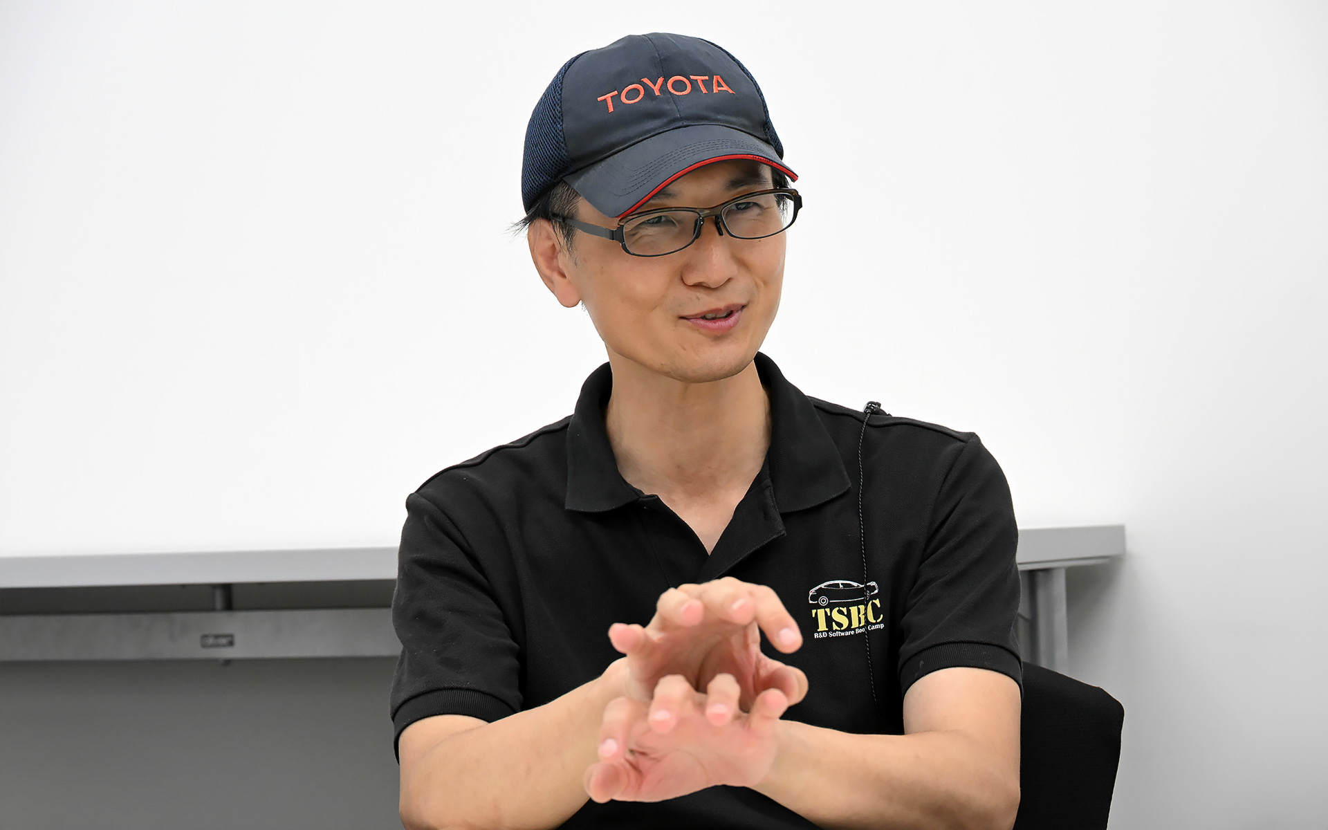 トヨタソフトウェアアカデミー 主査 大西悠季生氏。大西氏はトヨタソフトウェアアカデミー受講生の相談に乗るなど、指導教官として成長を促進していく立場にあった