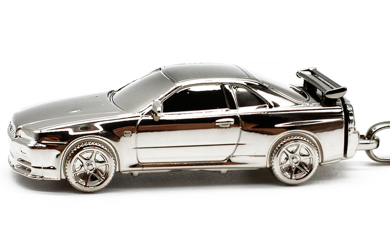 スカイライン メダル 日産「スカイラインGT-R（BNR34）」をモチーフにした「メタルキー