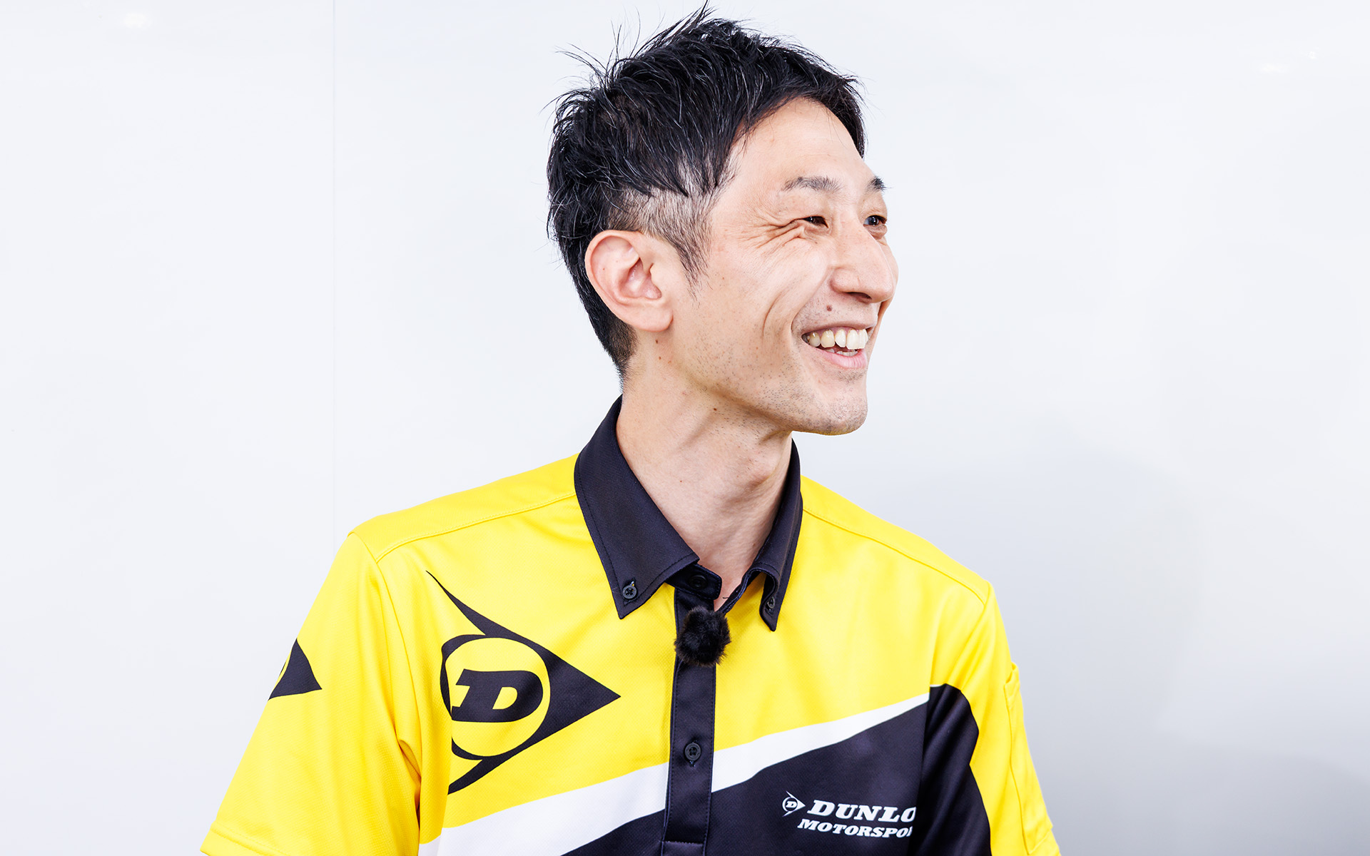 レース活動から市販タイヤへのフィードバック内容を語る菅野氏（GT500担当）