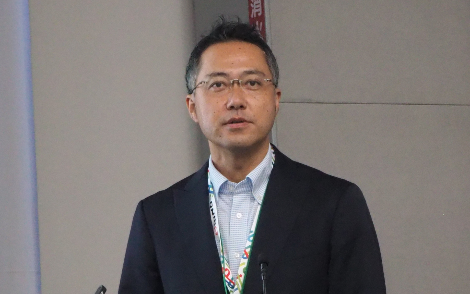 バス事業者を取り巻く課題と車内事故ゼロへの取り組みを説明する京王電鉄バス 取締役 安全技術部長の大野賢治氏
