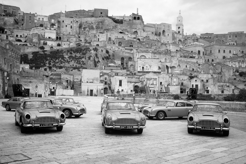 Ten DB5‘s, eight of which were made specifically for the film, against the backdrop of Matera, Italy (Photo: Nicola Dove). NO TIME TO DIE © Danjaq and MGM. NO TIME TO DIE, 007 and related James Bond Indicia<br>© 1962–2021 Danjaq and MGM. NO TIME TO DIE, 007 and realted James Bond Trademarks are trademarks of Danjaq. All Righst Reserved.