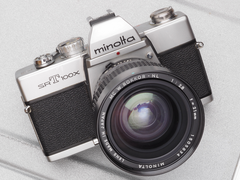 SR-T100Xってのも出て参りました。SR-T100に1/1,000秒を加えていますが、セルフは省略したままですね。スッキリしていてよさそうだけど、握ると指がかりはないわけで不安ですね。装着レンズはユージンが好きだったMC WロッコールNL 21mm F2.8です。デカいですがよく写ります。