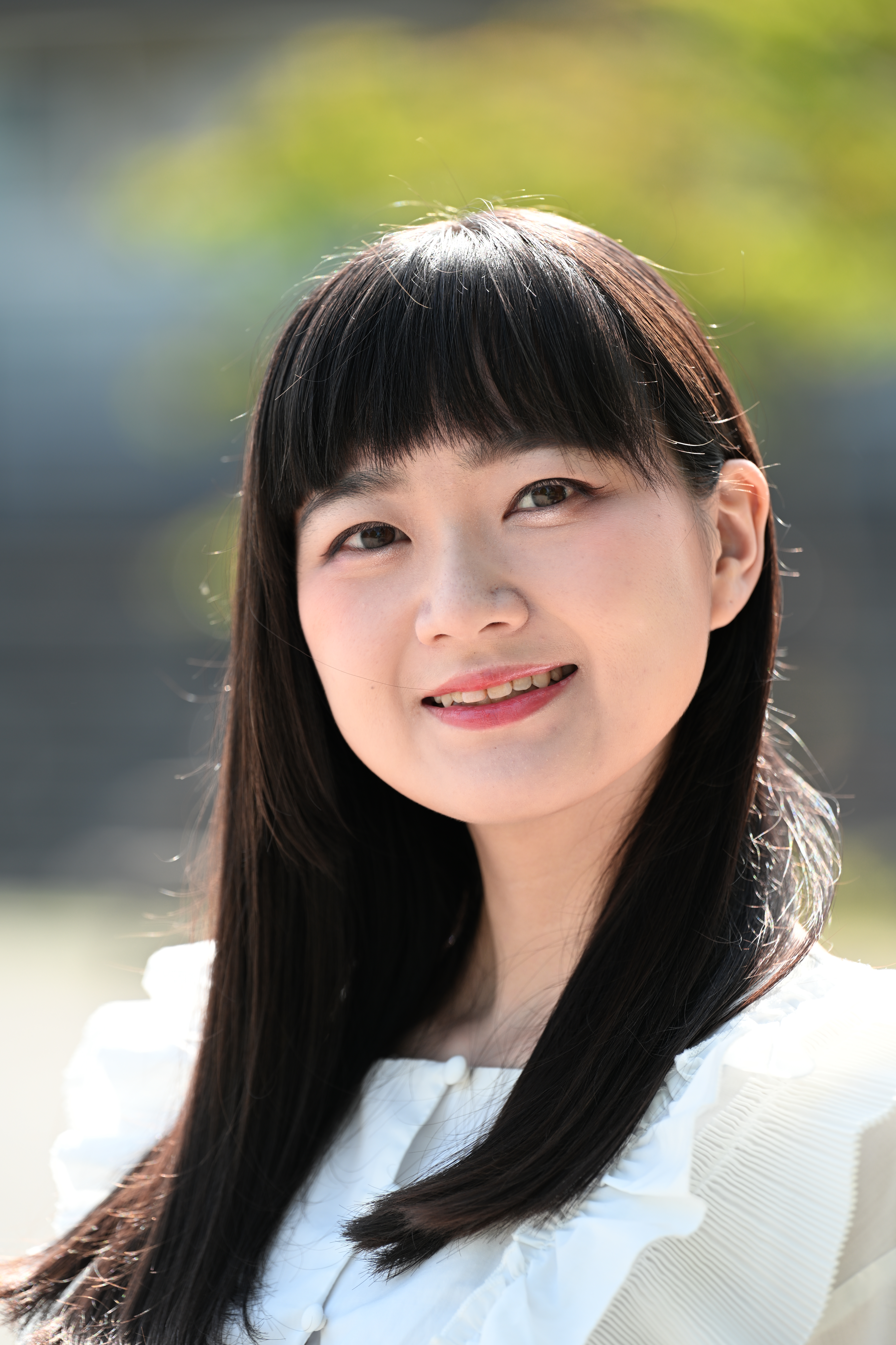 人物印象調整「M-Y」をM2.0、「明るさ」+2.0に設定した。顔が明るくなり、マゼンタが足されたことで健康的な肌色になった