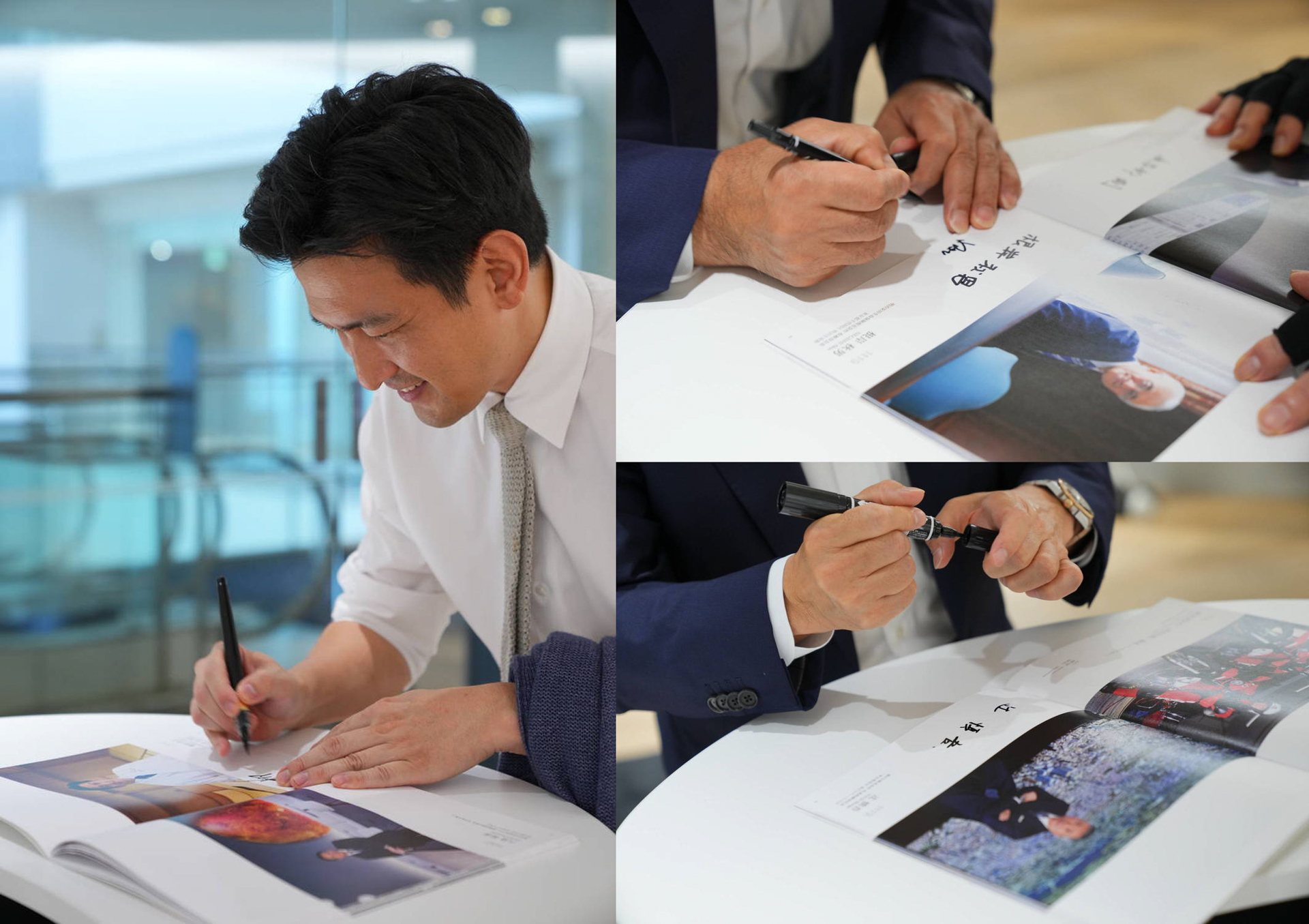 図録にサインをしてくださっている柳原尚之様、根岸秋男様、辻󠄀慎吾様