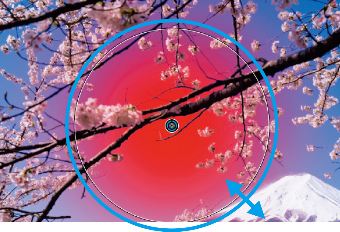 補正をしたい部分、ここでは空にポイントを置く。円の選択範囲が出てくるので、それを伸縮させてマスクの範囲を決める