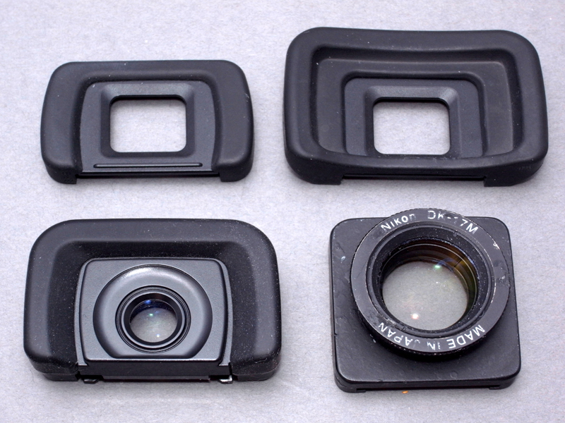 <b>フォーサーズ用アイカップの比較。E-420標準アイカップ（左上）、E-3標準アイカップ（右上）、マグニファイヤーアイカップME-1と同等品と思われるパナソニック製アイカップ（左下）、ニコンDK-17M自作改造品（右下）。こうして比較すると、マグニファイヤーアイカップがいかにコンパクトなのかがわかる</b>