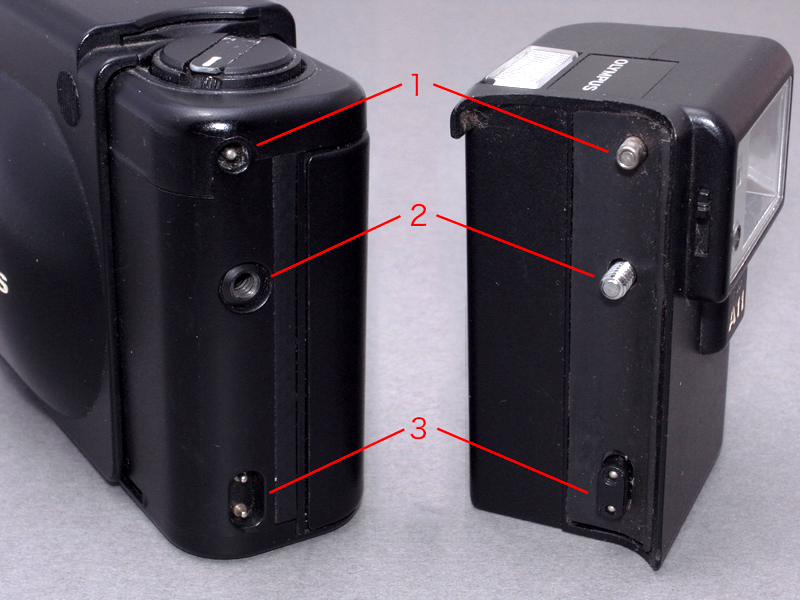 <b>XAとA11の接続部分を確認してみる。【1】が電源ONスイッチの連動部分。XAから押し出されたピンが、A11の電源スイッチを押し込む仕組みだ。【2】はカメラとストロボを接続するネジ部分。【3】は特殊な形状のシンクロソケットで、シンプルな2極式だ。それぞれが今回の改造ポイントになる</b>