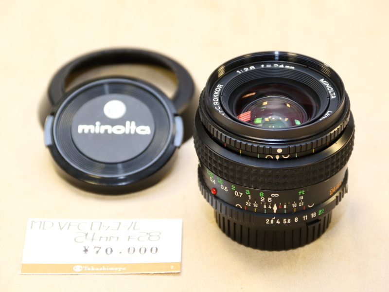 <strong class="">ミノルタ／MD VFC ROKKOR 24mm F2.8</strong><br class="">像面湾曲収差の特性を可変させることで、画面中央部と周辺部の距離が異なるような被写体でもピントを合わせることのできるレンズ。通常の広角レンズとしてももちろん使える。（スズキカメラ商会）