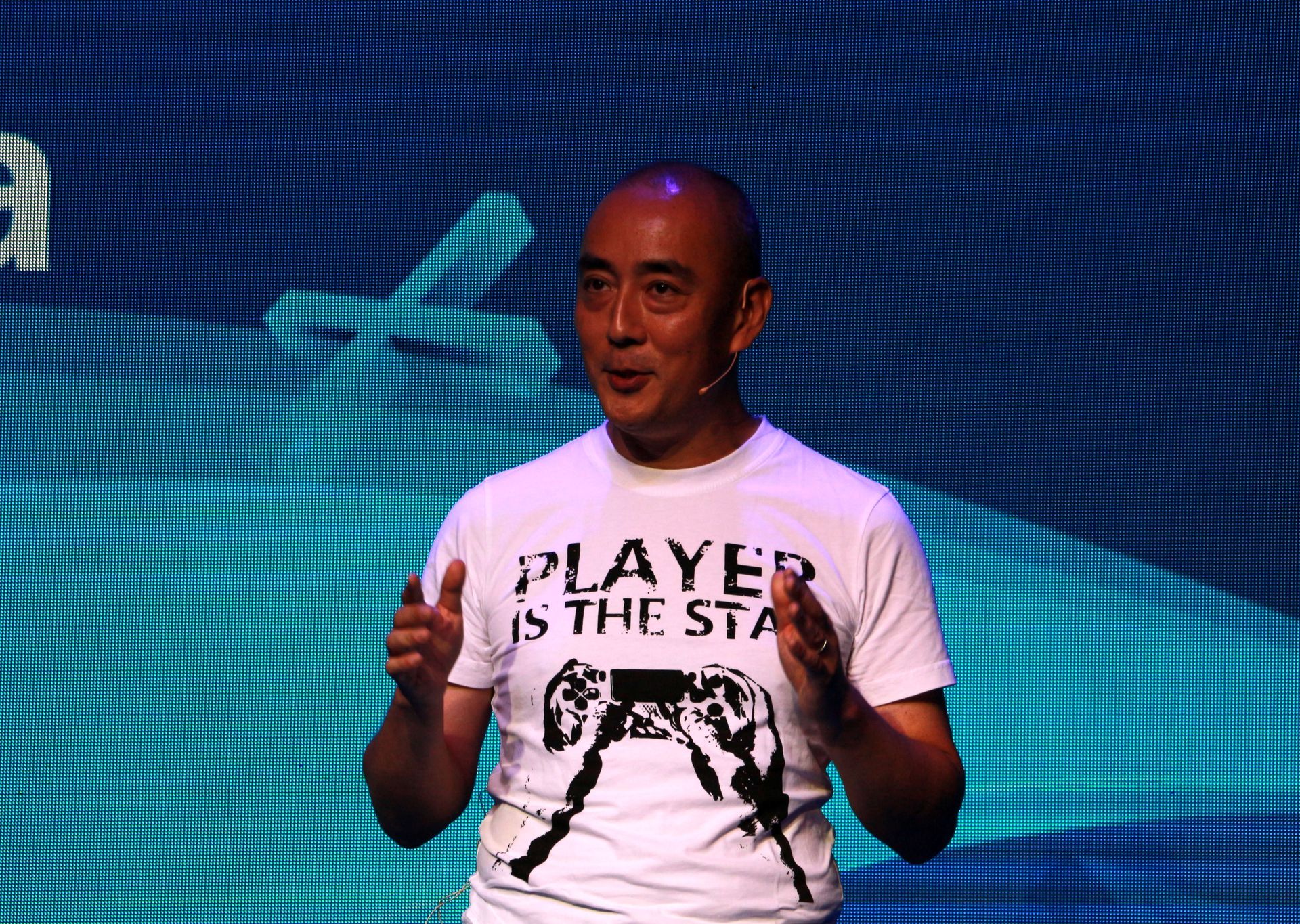 北京語でプレゼンを行なうSIE上海プレジデント添田武人氏