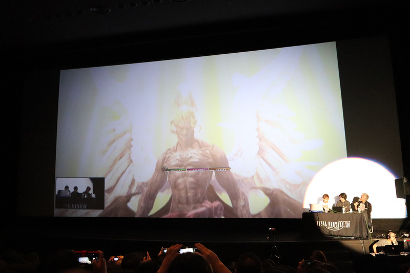 スクリーン横に吉田氏らが並んでプレイ。観客は巨大スクリーンの映像を満喫できた