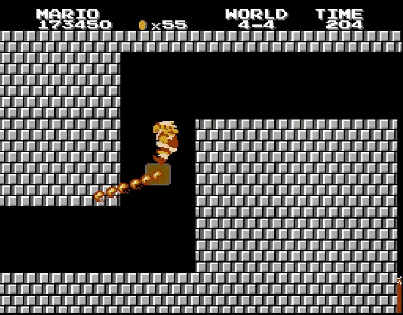 ワールド4-4より。ファイアバーを避けつつ、壁に向かってジャンプした反動を利用して上部のブロックに着地するテクニックが必要だ