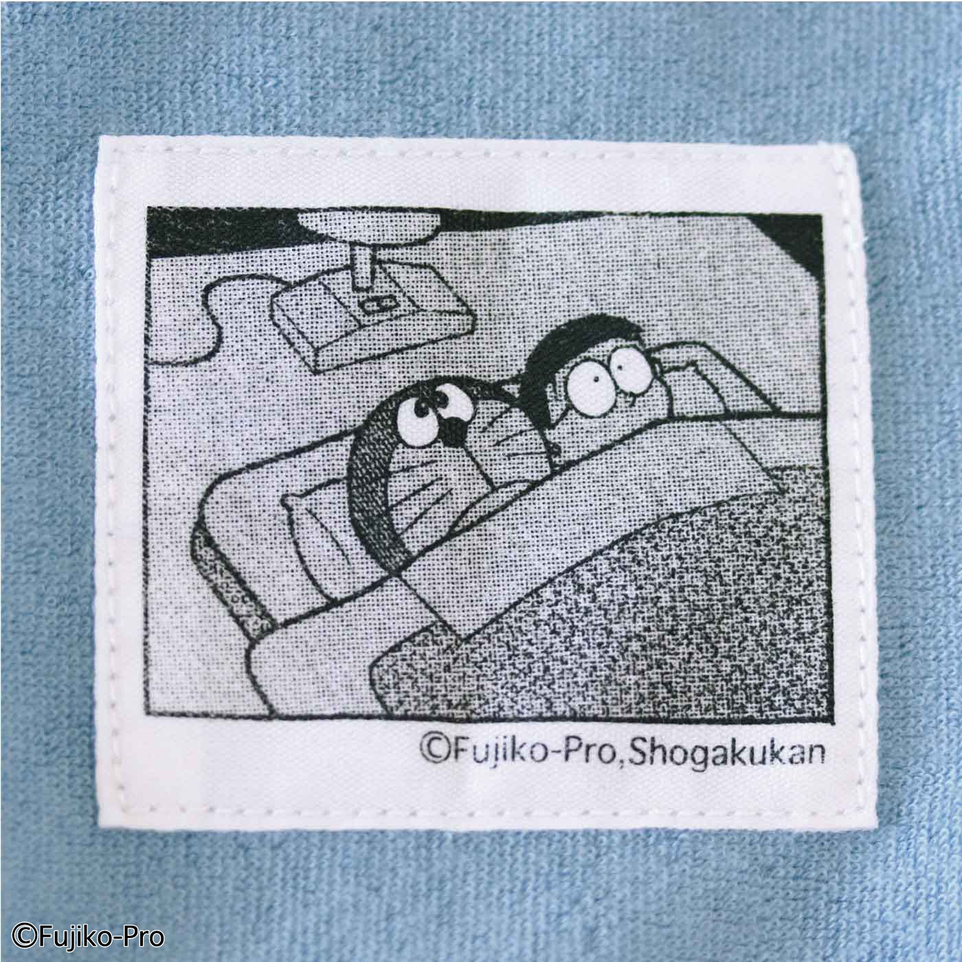 「さようなら、ドラえもん」のワンシーンをタグにデザイン