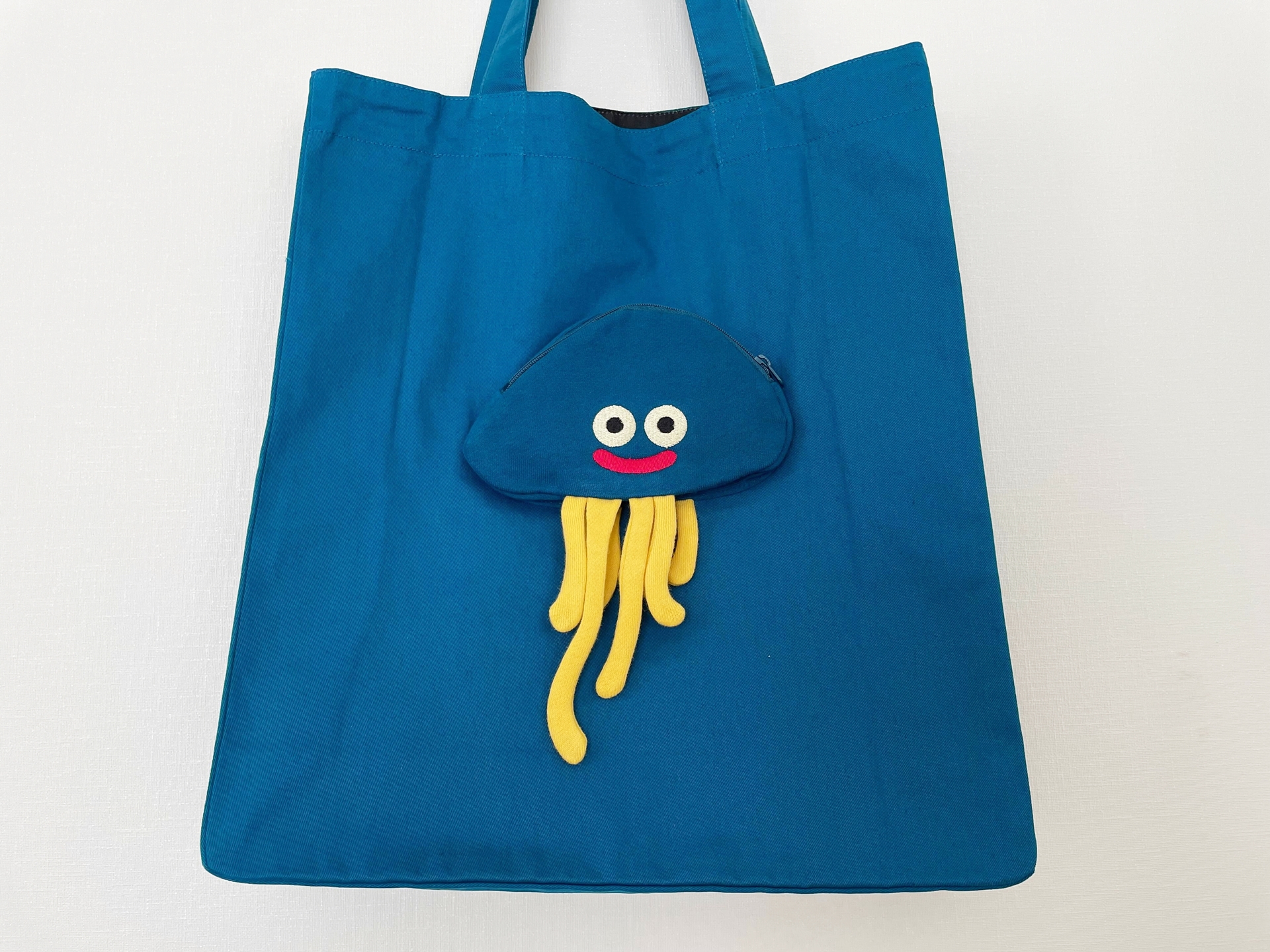 「ドラゴンクエスト DQ+g トートバッグ ホイミスライム」。なんといってもホイミスライムがかわいい