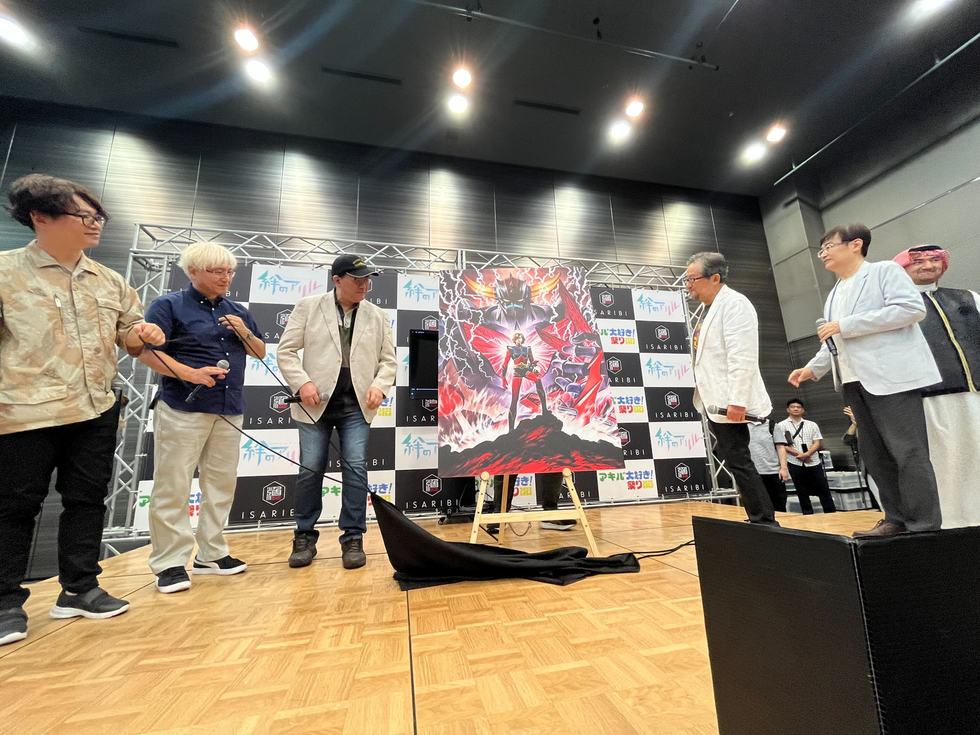 イベントでタイトル披露が行われた。左から大河内一楼氏、貞本義行氏、福田己津央氏、永井豪氏、田中公平氏、ブカーリ・イサム氏