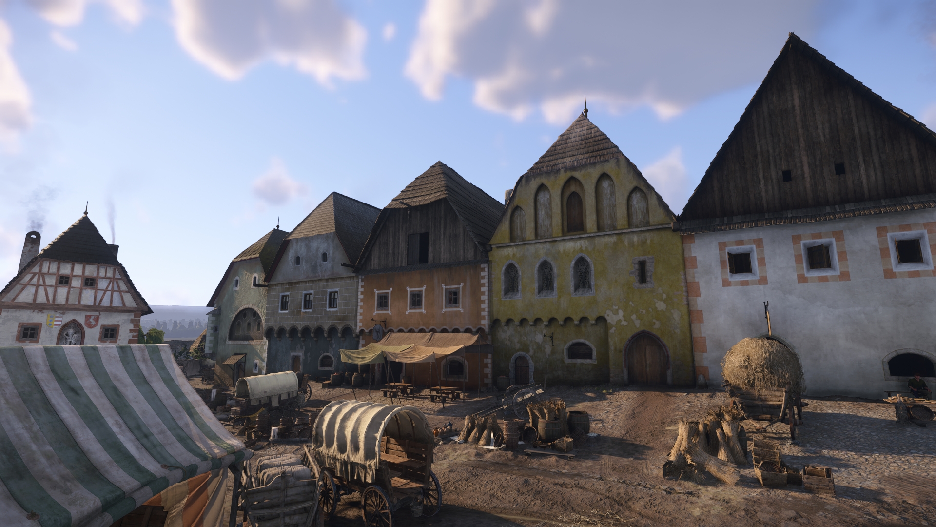 「KCD2」では市場が開かれており、広場に面した酒場（テントがかかっている店舗）がヘンリーの拠点となる