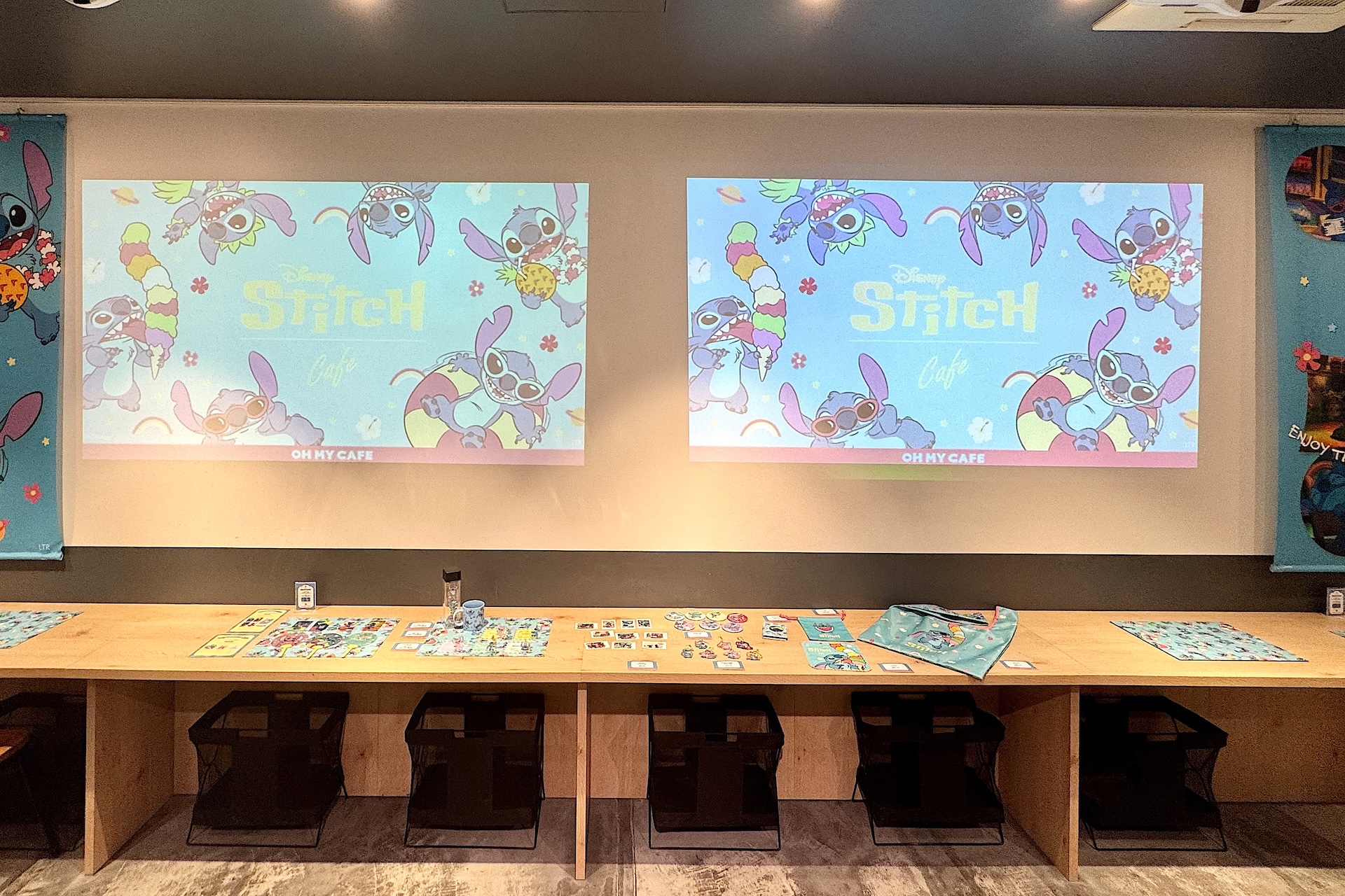 店内の一画ではプロジェクターで映像が放映されており、まるでちょっとした展示会のような雰囲気に。テーブルには内覧会用のグッズがディスプレイが並べられているが、通常ここは客席として利用できるスペースだ