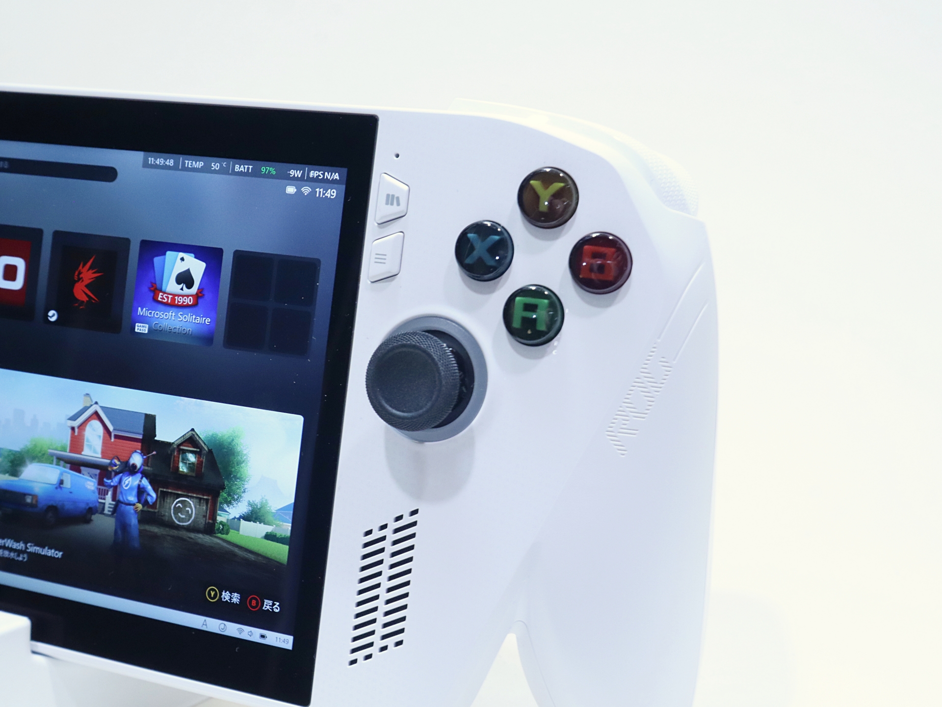 右側にはA/B/X/Yボタン、アナログスティック、メニューボタン、下部にはスピーカーを備える