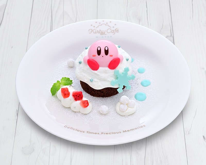 ワドルディたちと雪あそびを楽しんだカービィが、ガトーショコラにつもったふわふわクリームの上で「ふぅ～」とひとやすみしているようなメニュー