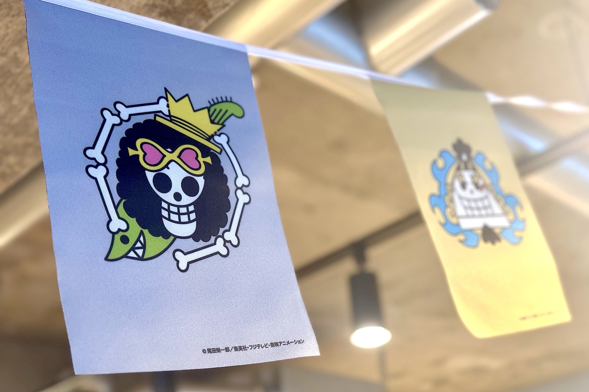 コラボ第1弾のメニュー表。ルフィたちがメニューを手に持った描き下ろしイラストが使用されている