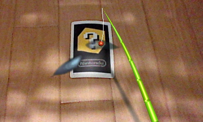 カードを置いた床の周辺が水面となり、動き回る魚などを釣り上げて遊ぶ