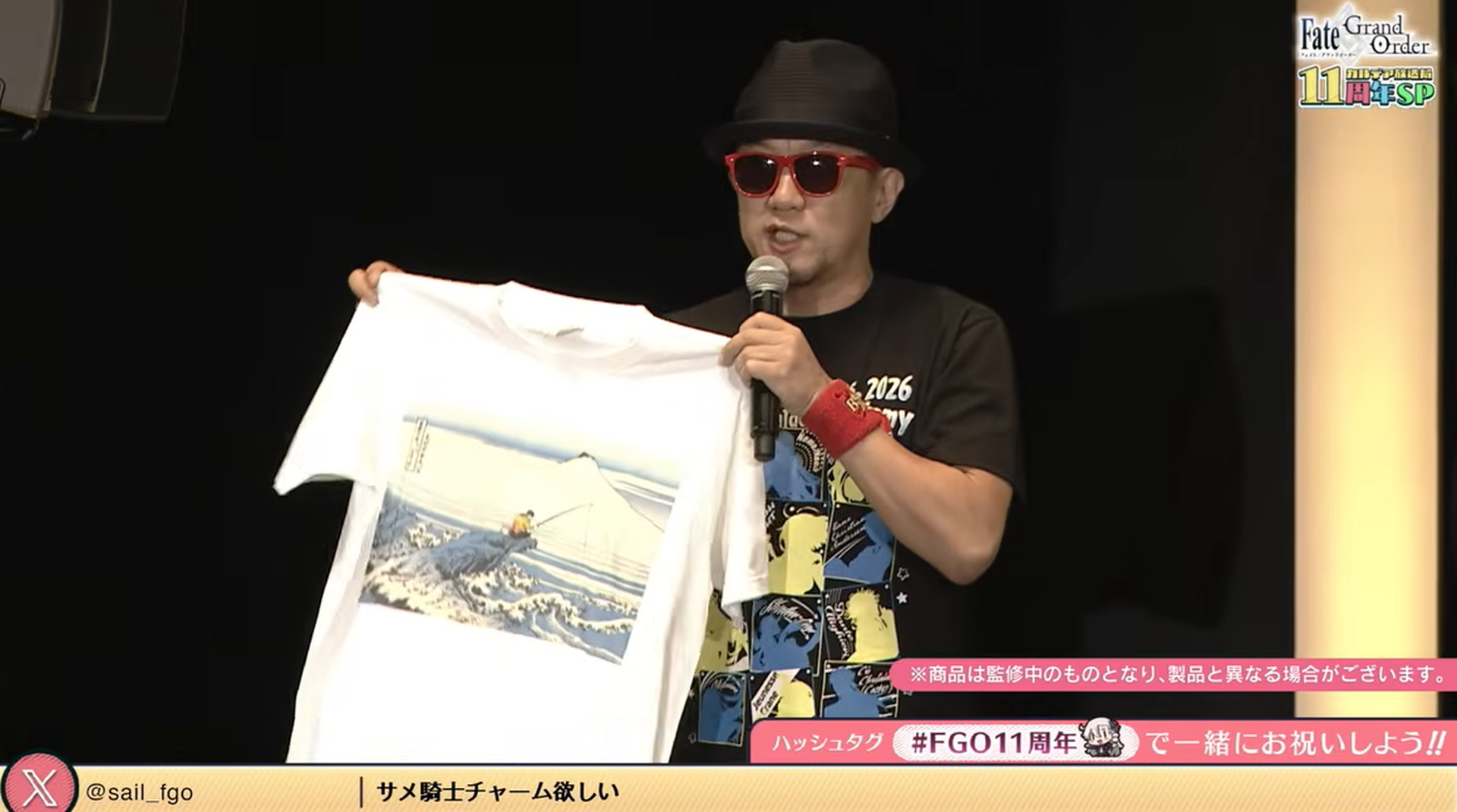 同マーケティングディレクターのバスター石倉氏はお気に入りの直販限定Tシャツをアピール