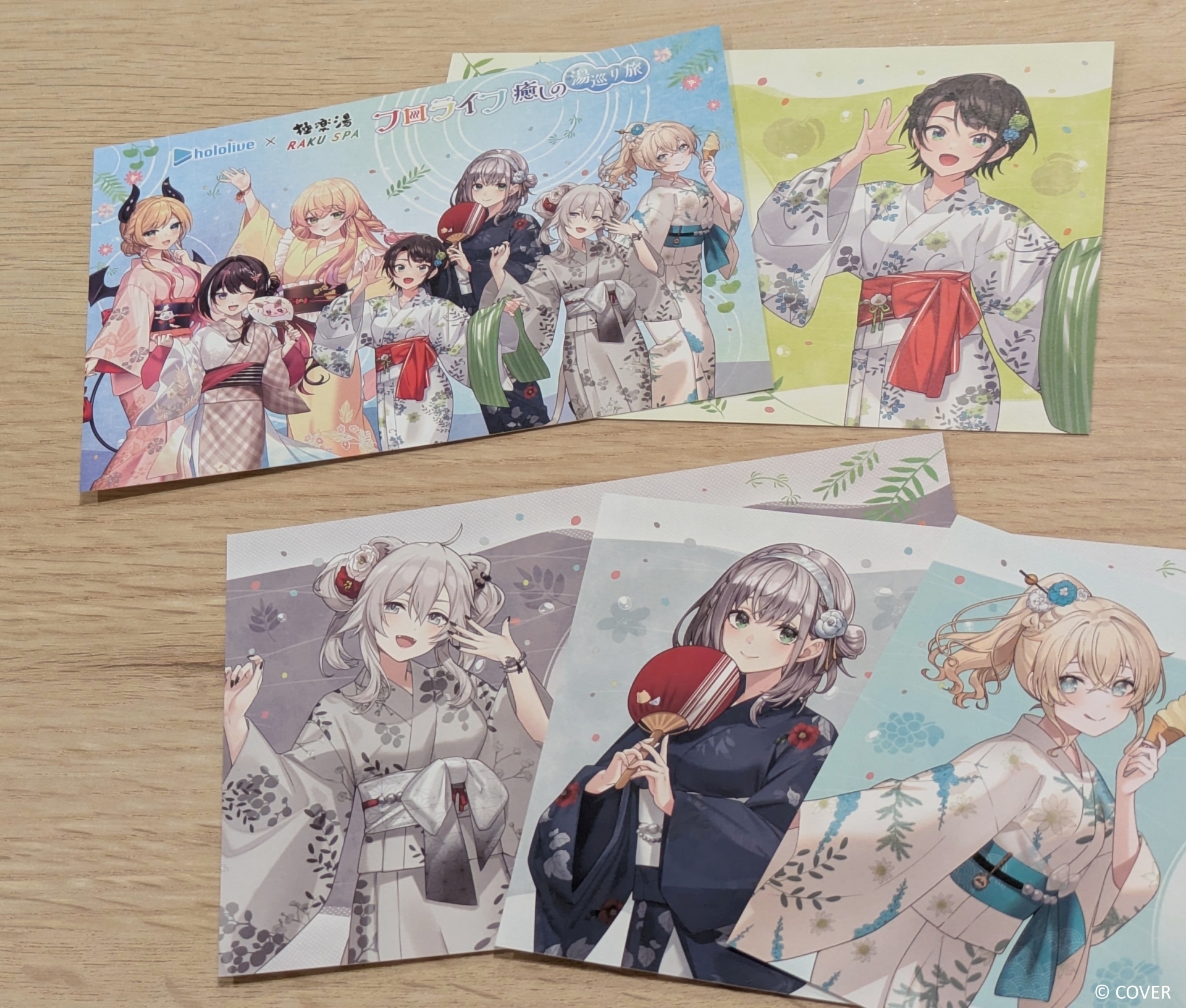 フォロー＆ハッシュタグ投稿でプレゼントされるポストカード。期間によって絵柄が異なり、内容は伏せるがホロライブメンバーの手描き風メッセージも記されている