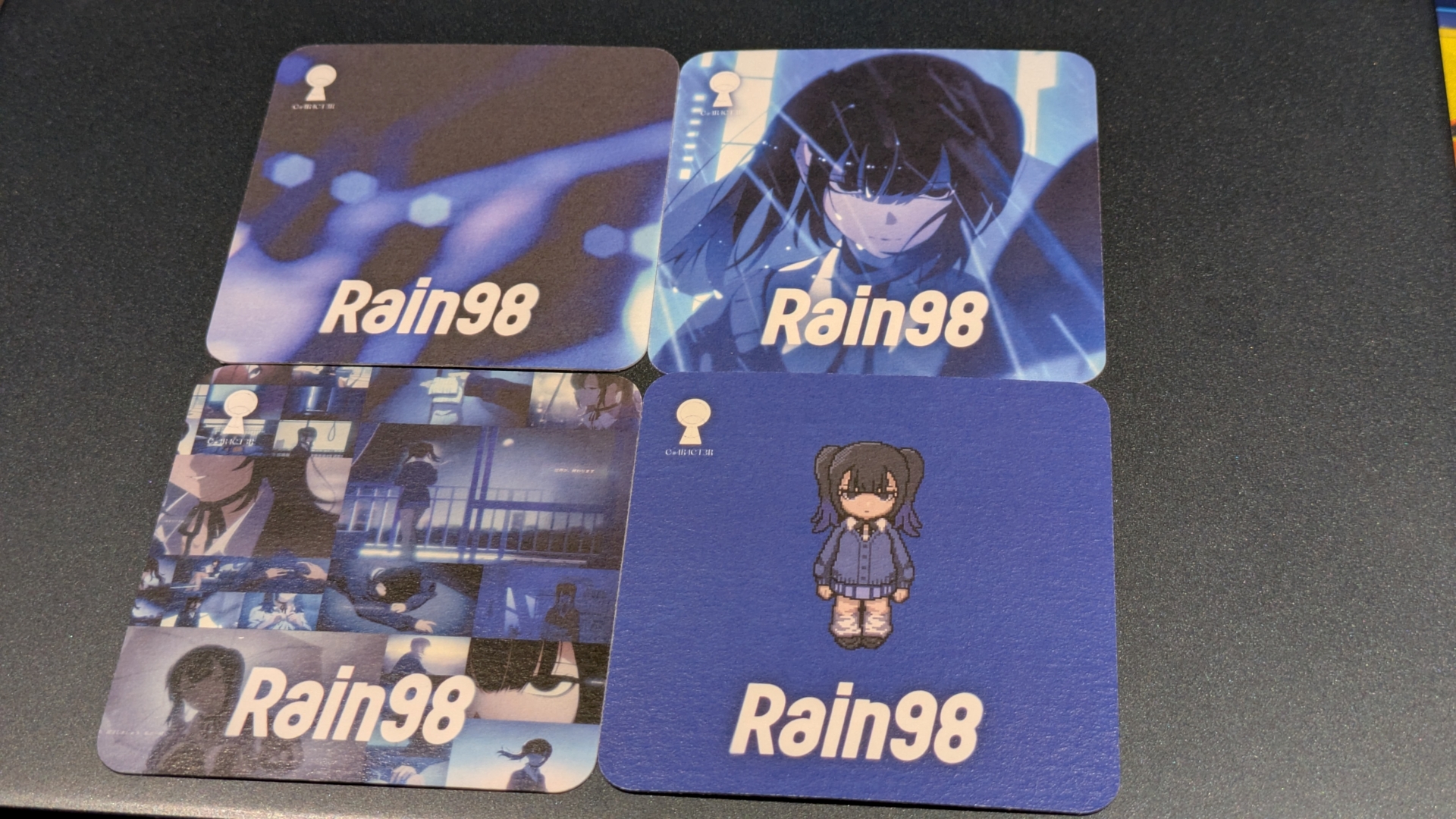 店舗では「Rain98」とのコラボカクテル『メランコリーブルー』（ノンアル可）も提供中。コースターも配布されている