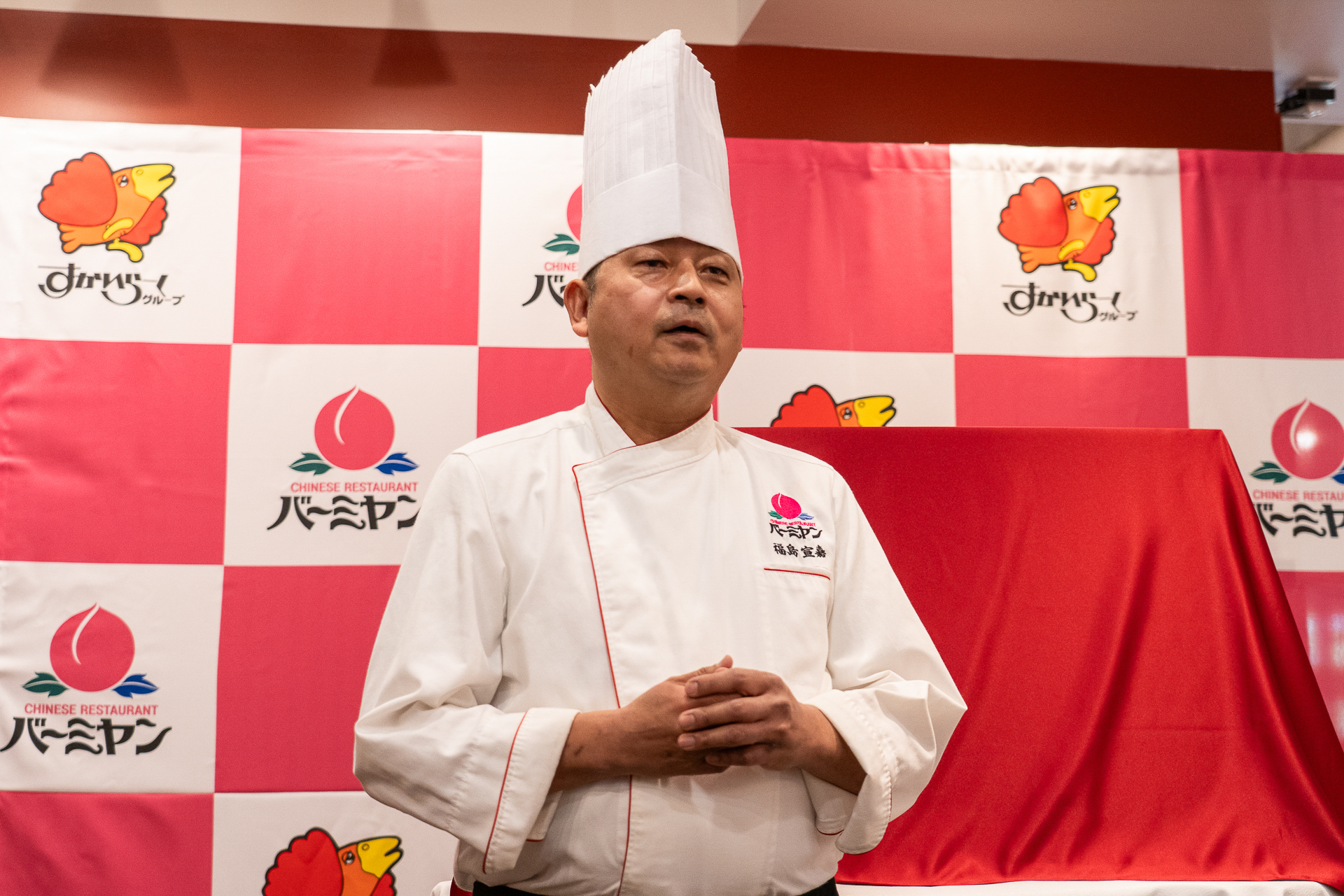 「昨年以上に本場の台湾料理を提供できるのでご期待を」とあいさつしたバーミヤンのメニュー開発担当 福島宣嘉氏