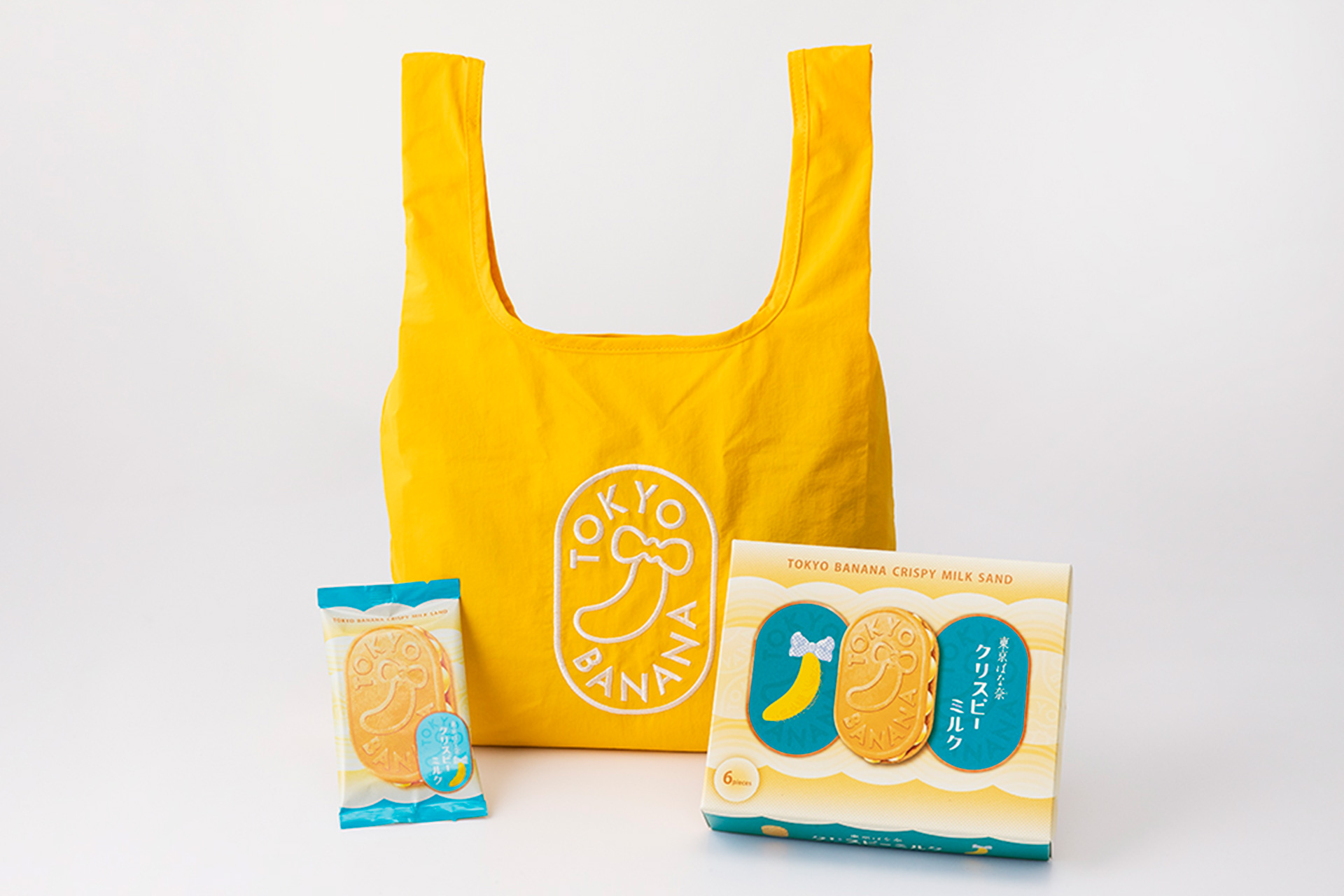 黄色いエコバッグに、白い糸で立体的に刺しゅうを施した