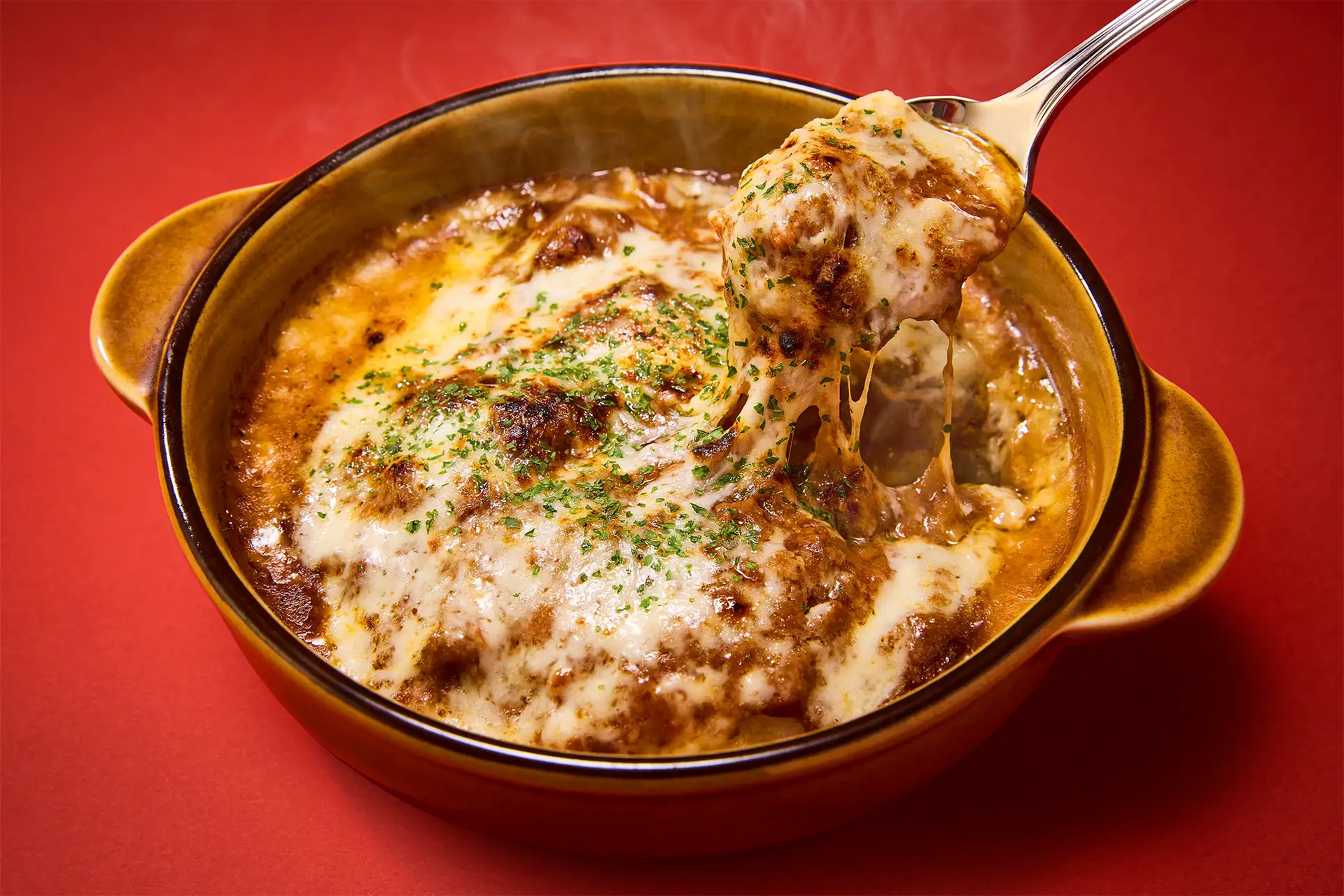 “格之進の肉おじさん”熟成肉のちょいとカレードリア（869円）