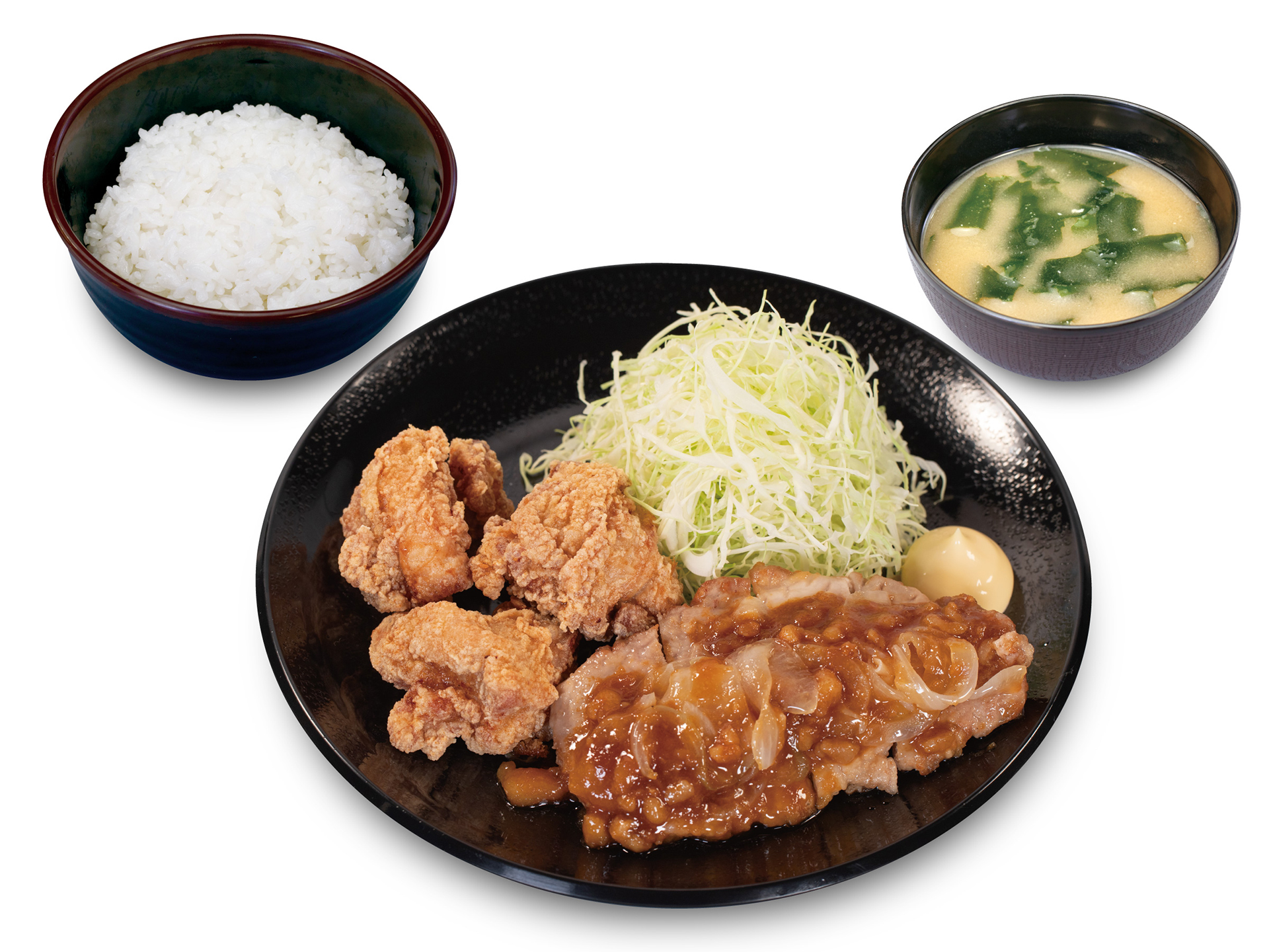 「背脂生姜タレのポークフライドステーキ＆本格唐揚げ定食」（990円）