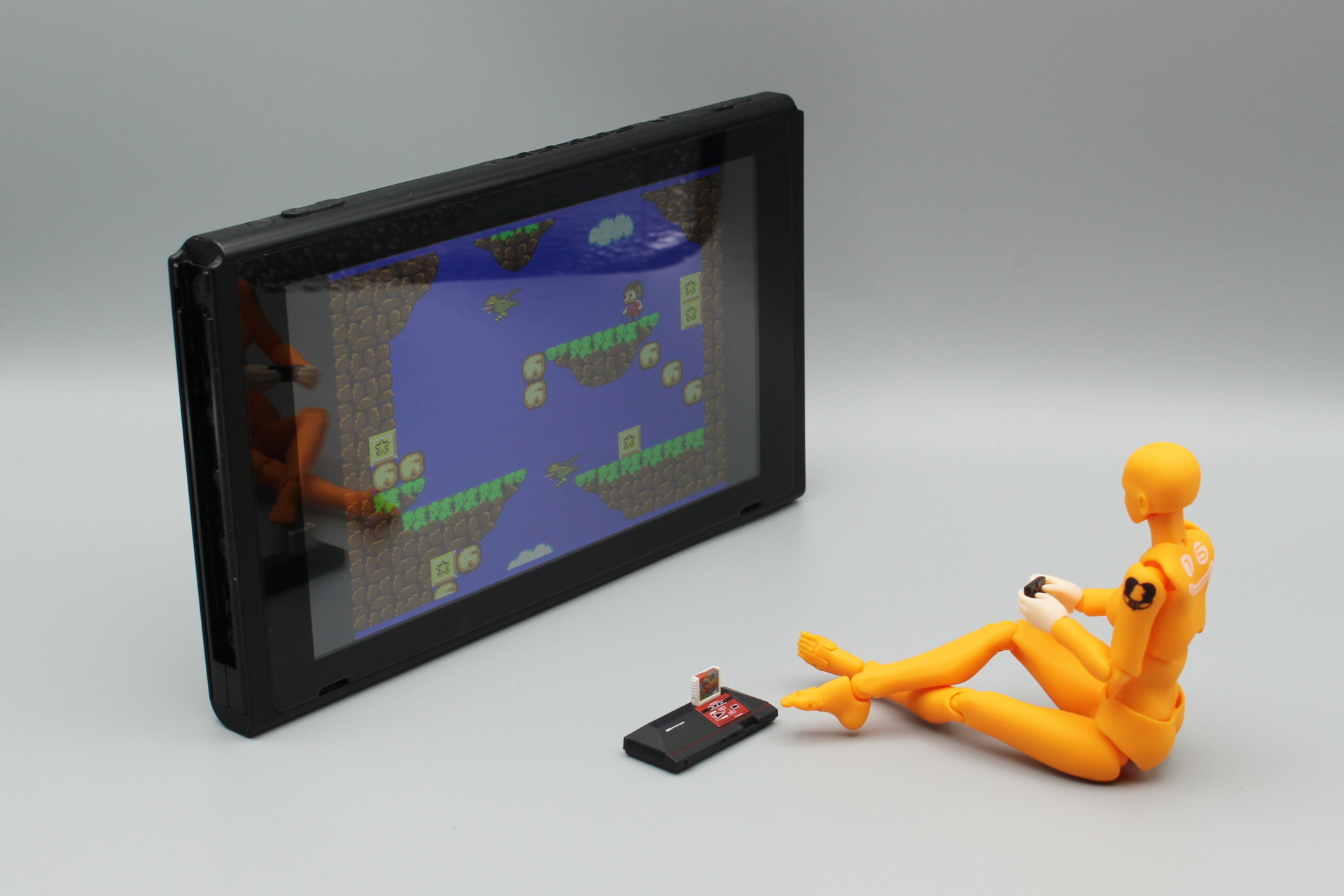 手元にTVのミニチュアがなかったので、Nintendo Switchのテーブルモードを大画面テレビに見立ててみた