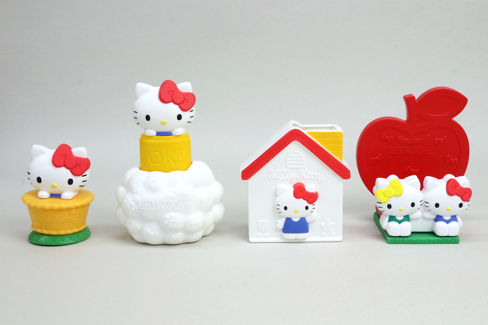 第1弾のラインナップ。左から「よくできました！スタンプ」、「ハローキティのOKタイマー」、「はぶらしホルダー」、「はみがきこしぼりスタンド」