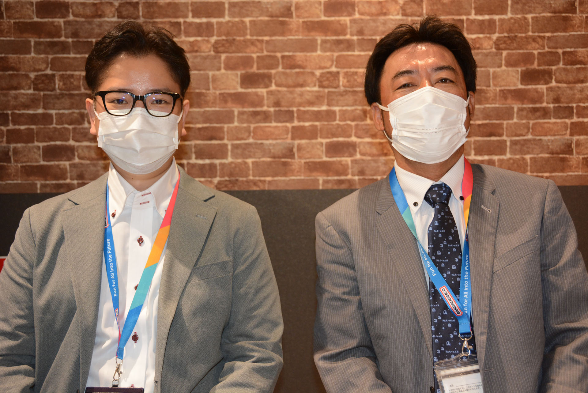 バンダイナムコアミューズメントソリューション事業部ソリューションマネージャーの前田一也氏(写真左)と、ソリューション事業部エクスペリエンス事業部ゼネラルマネージャーの佐々木晶士氏（写真右）