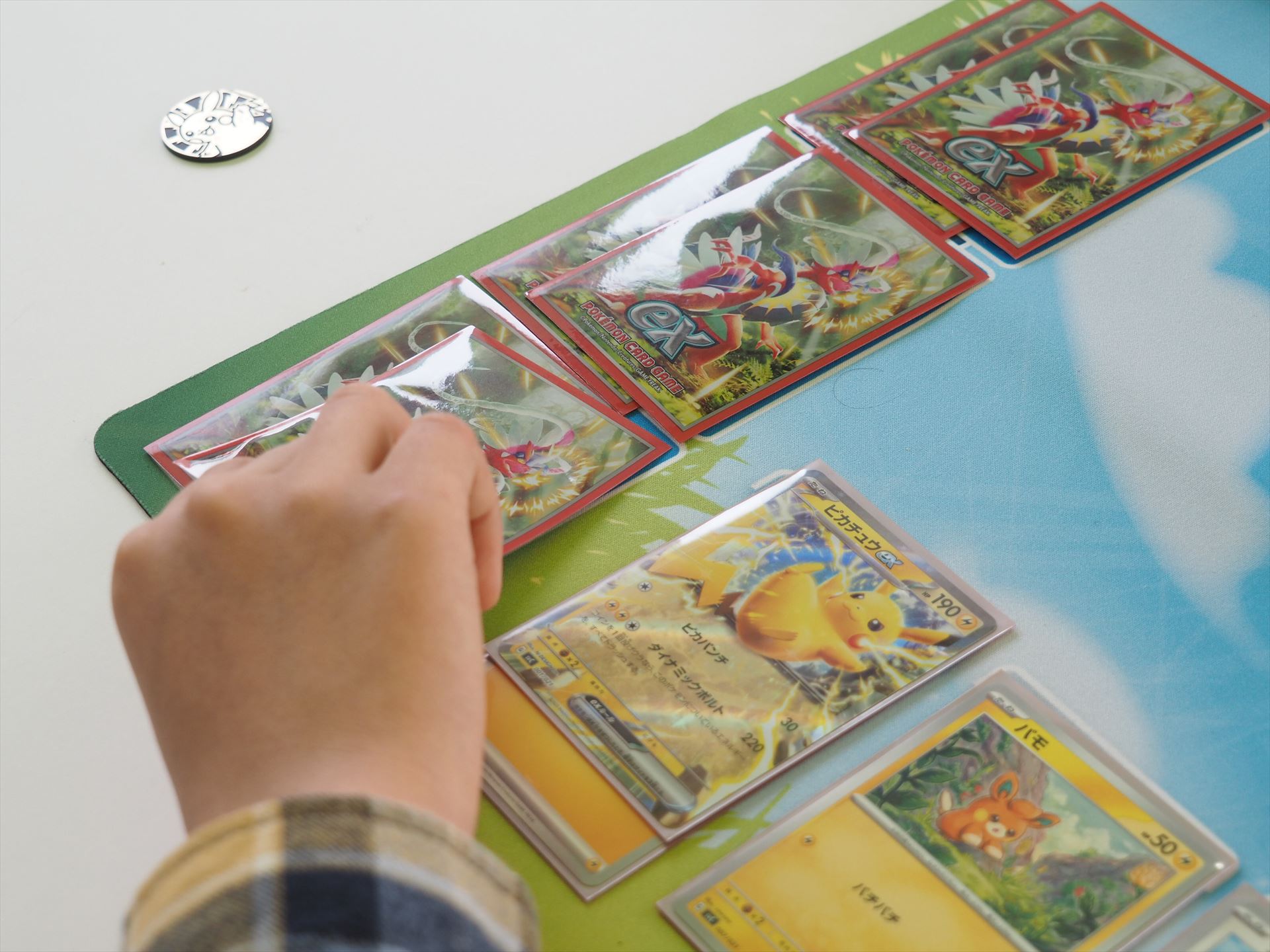 相手のバトルポケモンを「きぜつ」させると、自分のサイドからカードを1枚引く（ポケモンexを「きぜつ」させた場合は、サイドからカードを2枚引く）