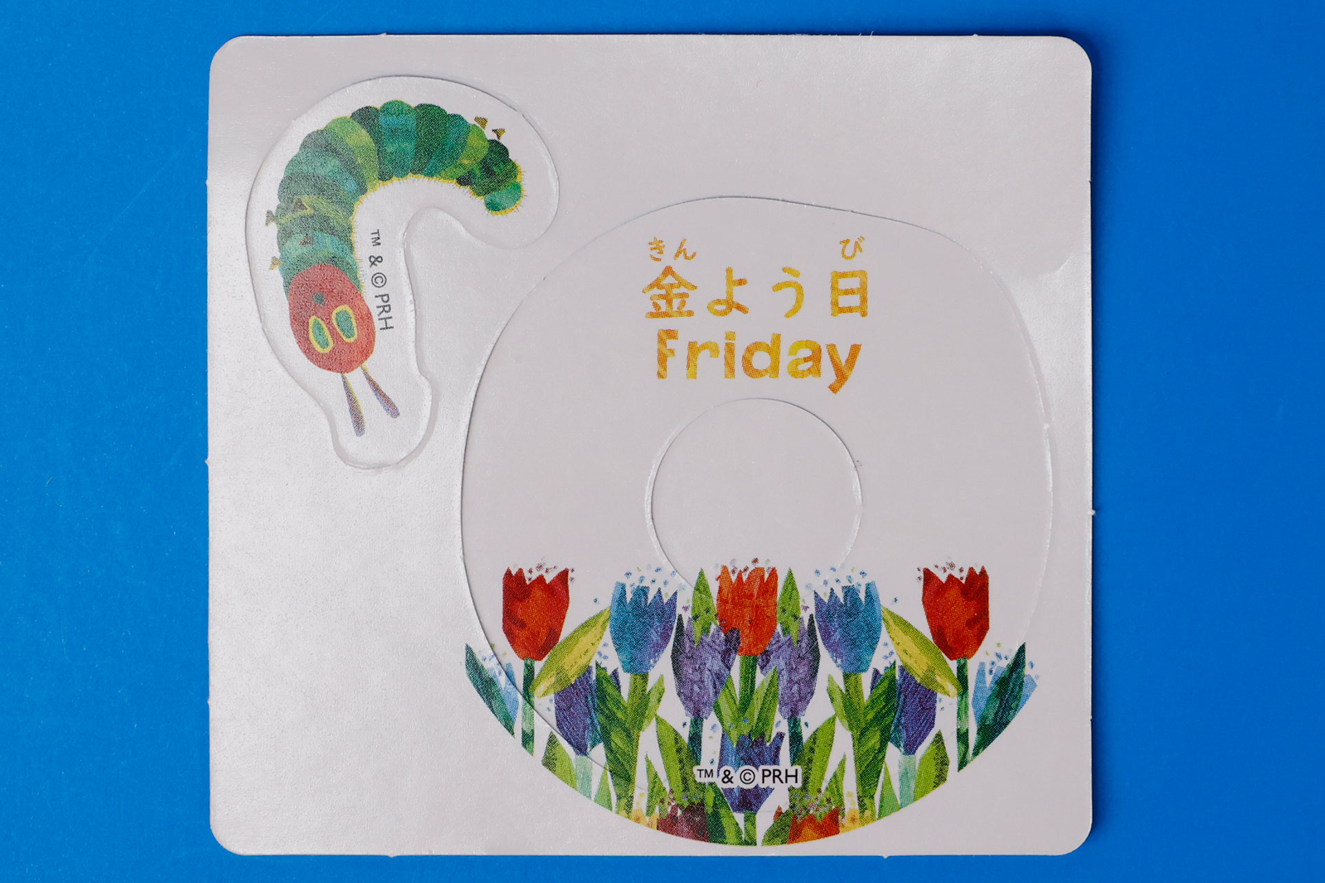 「オレンジとあおむしのカード」の裏面には、曜日が書かれている